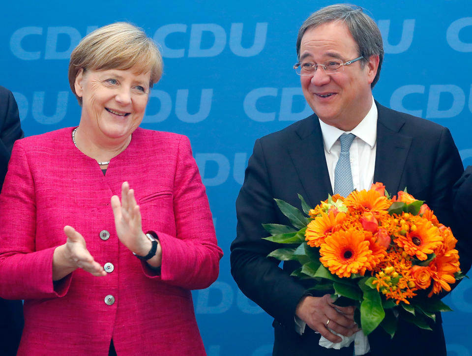 <p>Armin Laschet, top candidate of the Christian Democratic Union (CDU) receives flowers from German Chancellor Angela Merkel after the regional state elections of North Rhine-Westphalia, in Berlin, Germany, May 15, 2017. (Photo: Fabrizio Bensch/Reuters) </p>