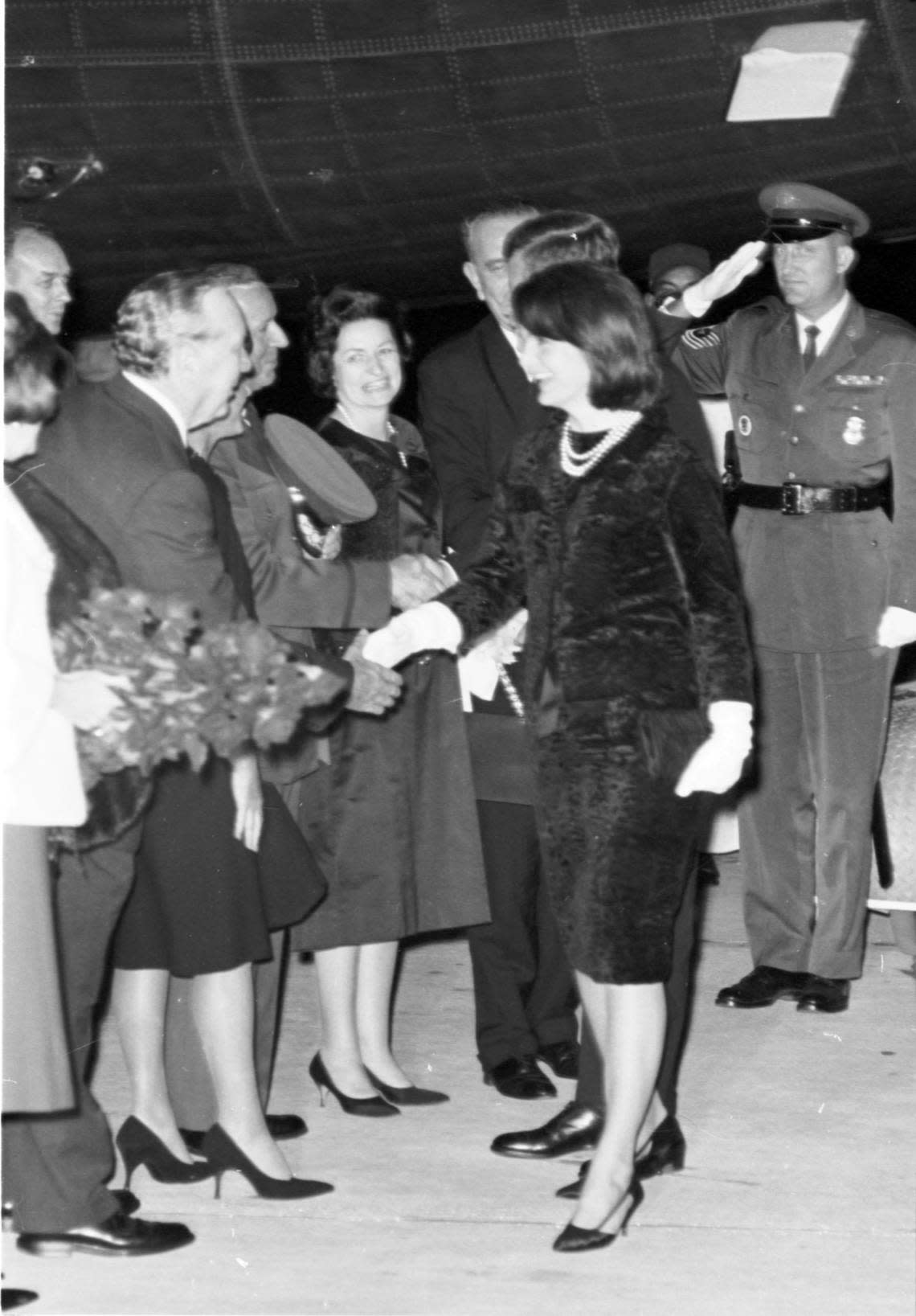 President John F. Kennedy and first lady Jackie Kennedy greet well-wishers along the reception line after Air Force One landed at Carswell Air Force Base, Fort Worth, on Nov. 21, 1963. Lady Bird and Vice President Lyndon Johnson are at the head of the line.