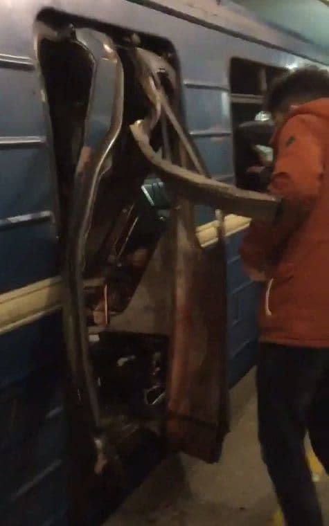 The mangled doors of the Metro train on which the bomb exploded - Credit: Twitter/RTVi