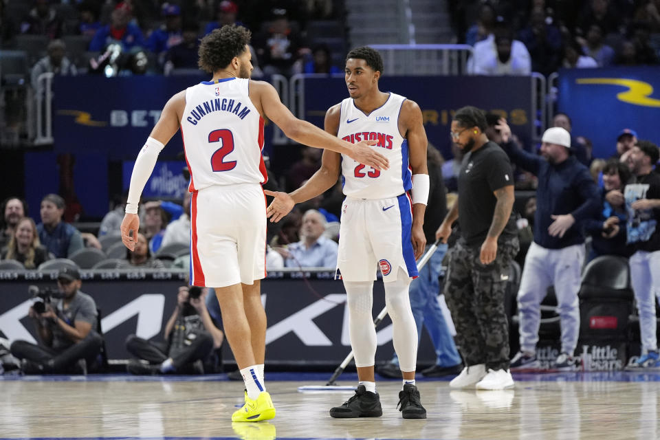 Detroit Pistons guard Jaden Ivey (23) is greeted guard Cade Cunningham (2) after a play during the second half of an NBA basketball game against the Brooklyn Nets, Thursday, March 7, 2024, in Detroit. (AP Photo/Carlos Osorio)