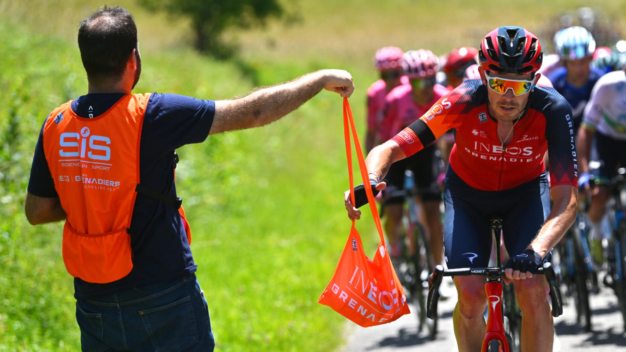  Ineos Grenadiers rider Luke Rowe collecting a musette with SiS nutrition 