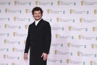 Actor Pedro Pascal poses for photographers upon arrival at the Bafta Film Awards, in central London, Sunday, April 11 2021. (AP Photo/Alberto Pezzali)