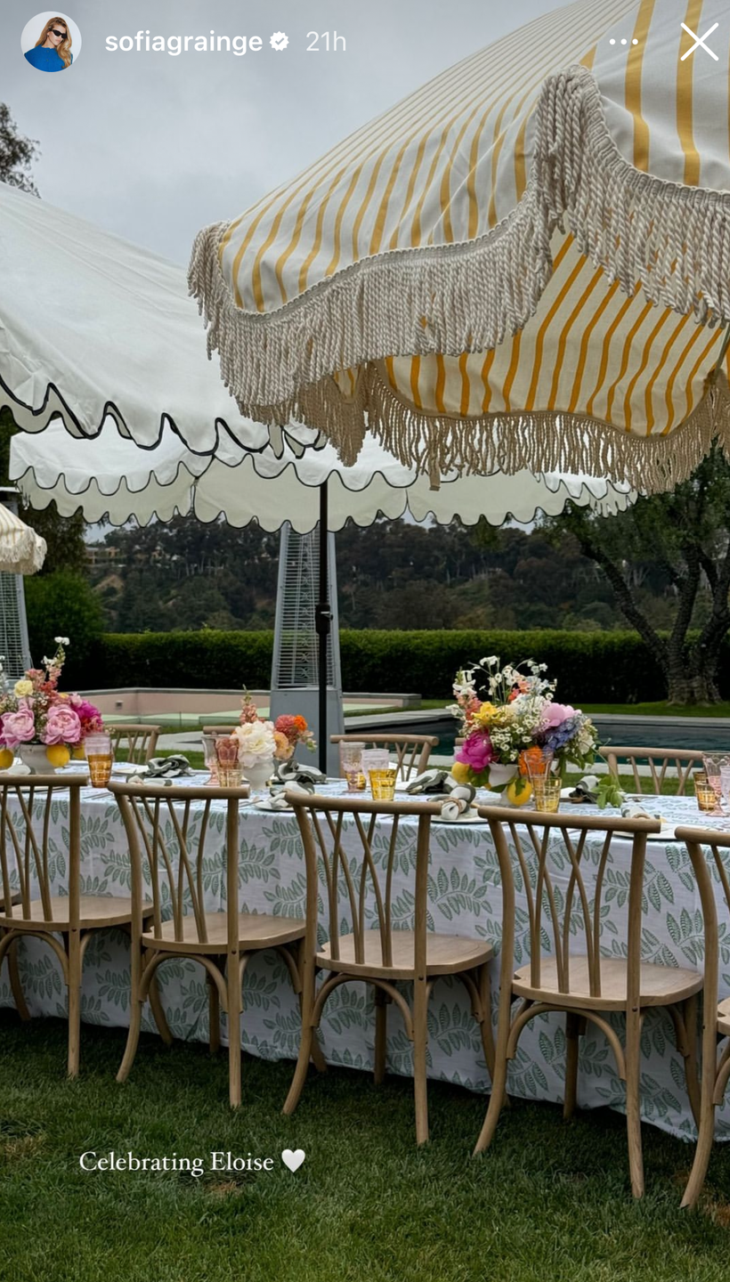 a table with chairs and a canopy