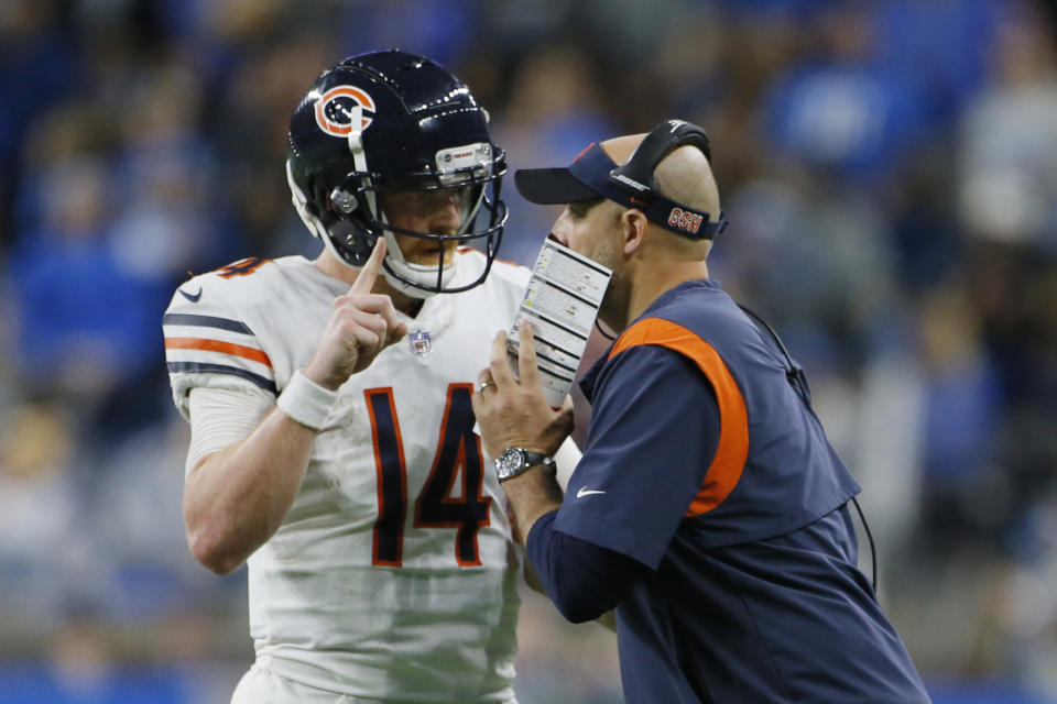 Chicago Bears quarterback Andy Dalton (14) talks with head coach Matt Nagy during the second half of an NFL football game against the Detroit Lions, Thursday, Nov. 25, 2021, in Detroit. (AP Photo/Duane Burleson)