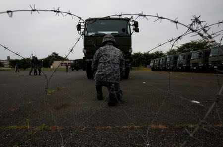 Japan Self-Defense Forces (JSDF) soldiers hold a drill to mobilise their Patriot Advanced Capability-3 (PAC-3) missile unit in response to recent missiles launch by North Korea, at JSDF Asaka base in Asaka, north of Tokyo, Japan, June 21, 2017. REUTERS/Issei Kato