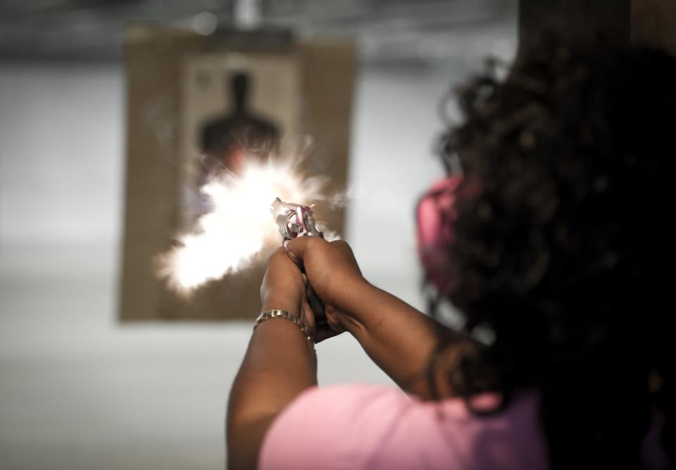 A woman practices at a shooting range outside Fredericksburg, Virginia, in April 2013.