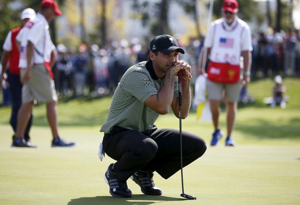 International team member Day of Australia reacts after missing a putt on the third green during the opening foursome matches of the 2015 Presidents Cup golf tournament at the Jack Nicklaus Golf Club in Incheon