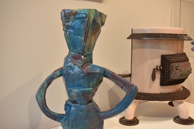 Works on display in the "Mad Dash" exhibit include a vitreous china and glaze piece called "Untilted" created by Tom Spleth in 1985 and a brass, iron and enamel piece called "Pink Barrel Stove" created by Thomas Uebelherr in 1993, as seen, Tuesday, March 12 in Sheboygan, Wis.