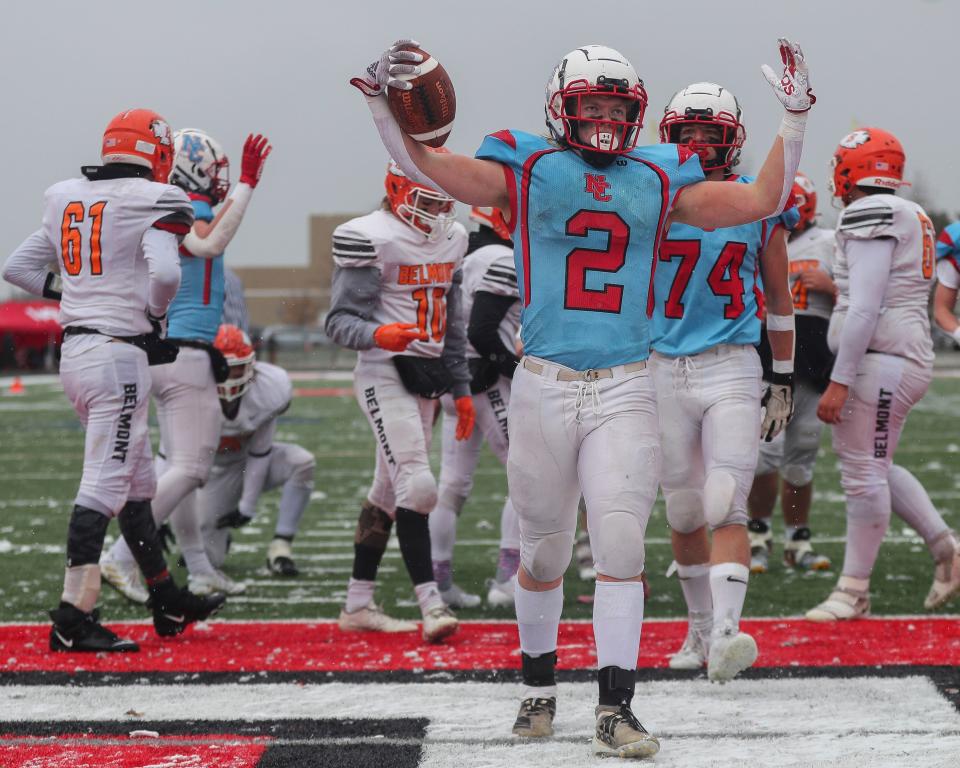 Newman Catholic's Thomas Bates (2) celebrates after scoring a touchdown against Belmont during the WIAA 8-player state championship game Saturday at South Wood County Stadium in Wisconsin Rapids.