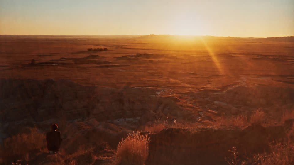 Fleisher Madden captured this shot of Saves The Day drummer Bryan Newman, backlit in the Badlands at "the perfect moment when the sun was going down.” - Amy Fleisher Madden/Courtesy Chronicle Books