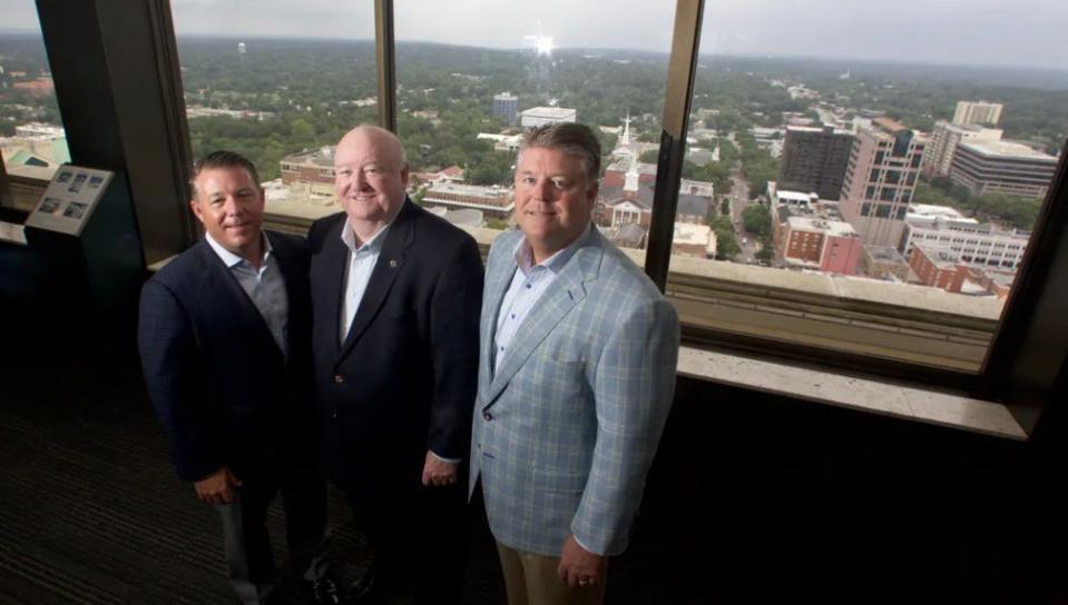 Former Florida Sen. Fred Dudley, center, stands next to his sons Chris, left, and Charlie, right, in this 2016 photo.