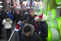 People line up outside Toys"R"Us store in Times Square before their Black Friday Sale in New York November 28, 2013. REUTERS/Carlo Allegri