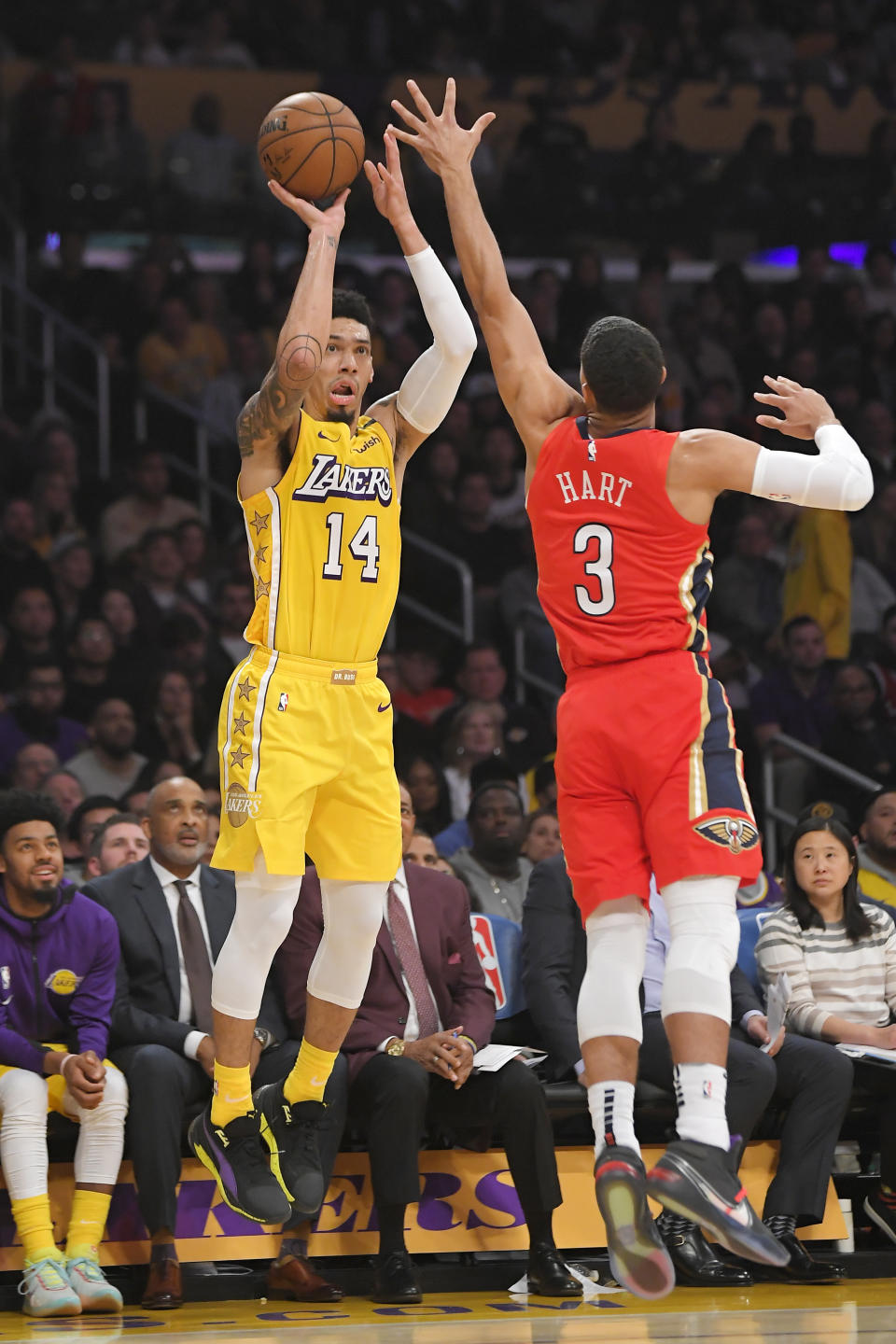Los Angeles Lakers guard Danny Green, left, shoots as New Orleans Pelicans guard Josh Hart defends during the first half of an NBA basketball game Friday, Jan. 3, 2020, in Los Angeles. (AP Photo/Mark J. Terrill)
