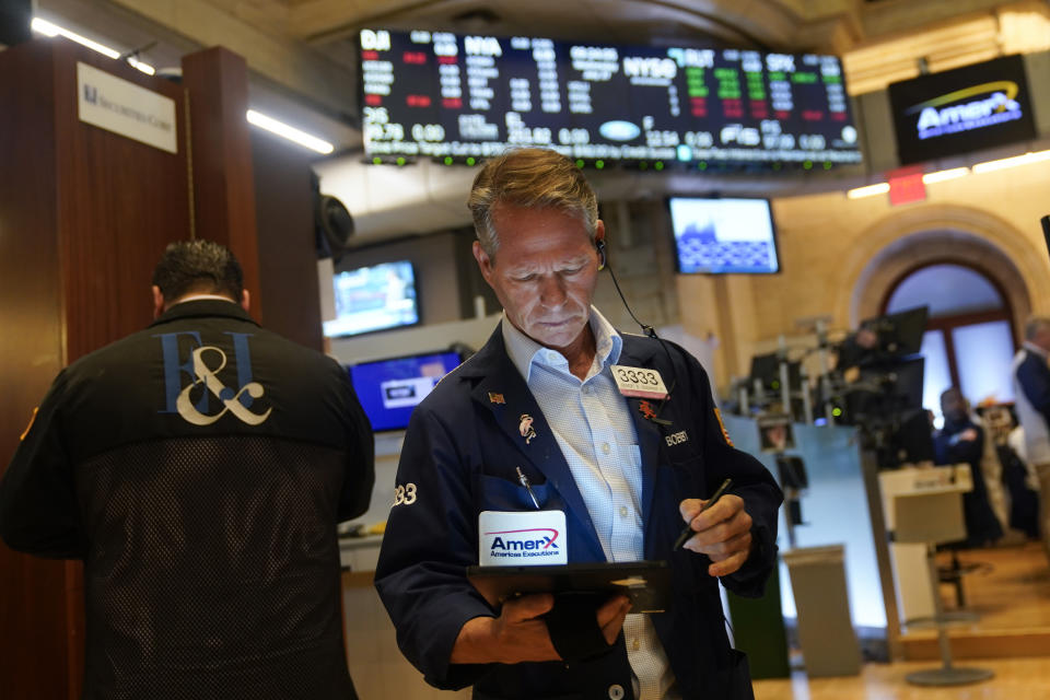 Traders work on the floor at the New York Stock Exchange in New York, Wednesday, July 27, 2022. (AP Photo/Seth Wenig)