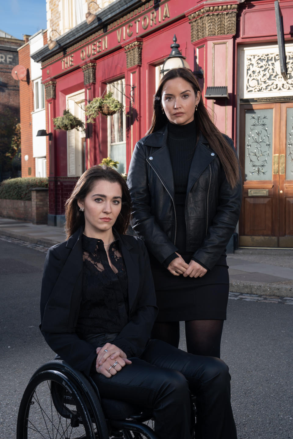 Penny and Lauren Branning standing outside the Queen Vic pub in EastEnders