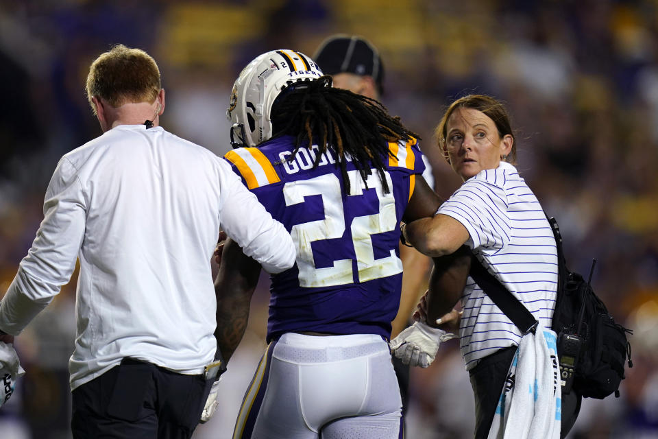 LSU running back Armoni Goodwin (22) is walked off the field after being injured in the second half of an NCAA college football game against New Mexico in Baton Rouge, La., Saturday, Sept. 24, 2022. LSU won 38-0. (AP Photo/Gerald Herbert)