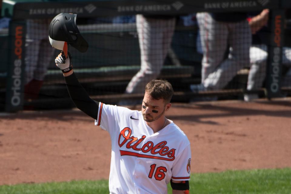 Baltimore Orioles right fielder Trey Mancini tips his helmet during his first at-bat against the Boston Red Sox at Oriole Park at Camden Yards.