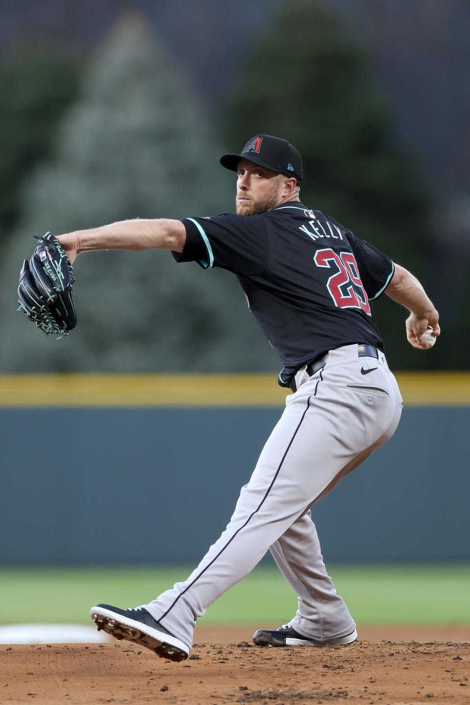 Starting pitcher Merrill Kelly #29 of the Arizona Diamondbacks throws against the Colorado Rockies in the first inning at Coors Field on April 09, 2024 in Denver, Colorado.