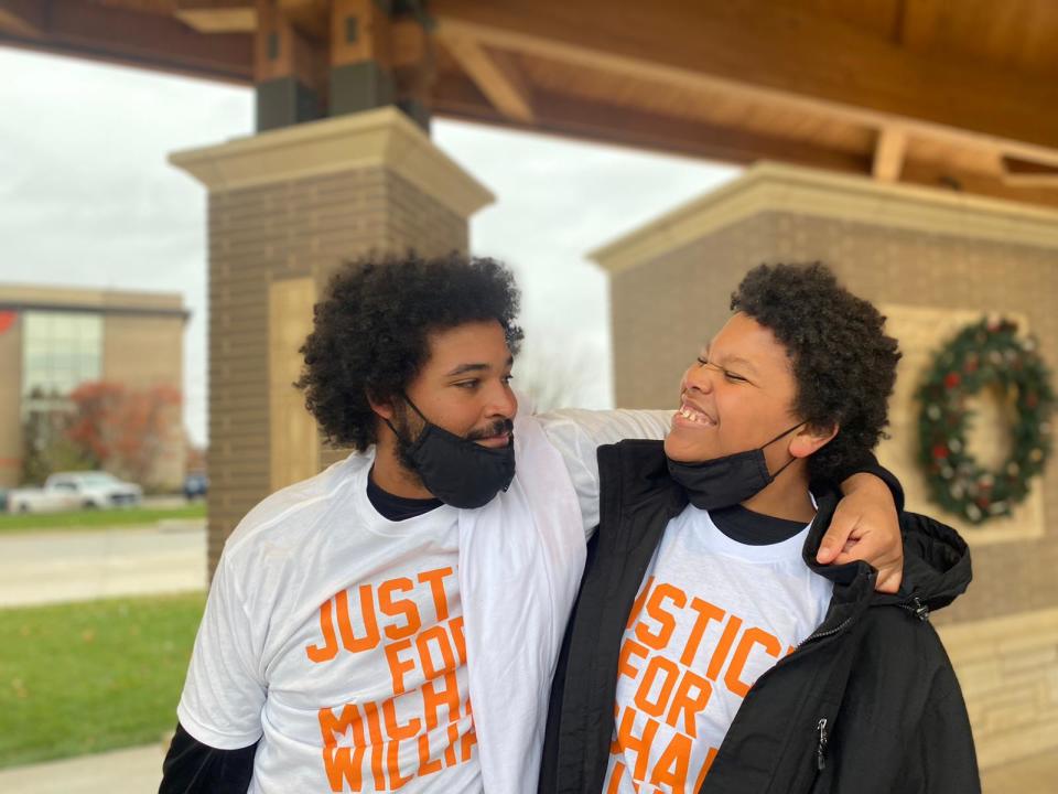 Danté Williams, 18, and Michael Williams Jr., 15, wear "Justice for Michael Williams" T-shirts during a vigil Saturday, Nov. 13, 2021, at Central Park in Grinnell in honor of their father, Michael Williams, who was killed last year.