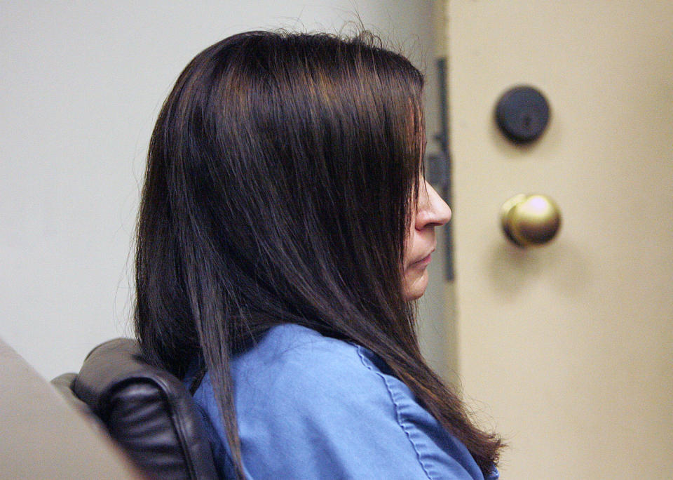Former Riverside Unified School teacher Andrea Cardosa sits in court as her arraignment is postponed at the Robert Presley Hall of Justice in Riverside, Calif. Wednesday, Feb. 5, 2014. Cardosa, 40, of Perris, is charged with 16 felonies, including aggravated sexual assault of a child, related to two former students. (AP Photo/Terry Pierson/The Press-Enterprise) MAGS OUT; MANDATORY CREDIT