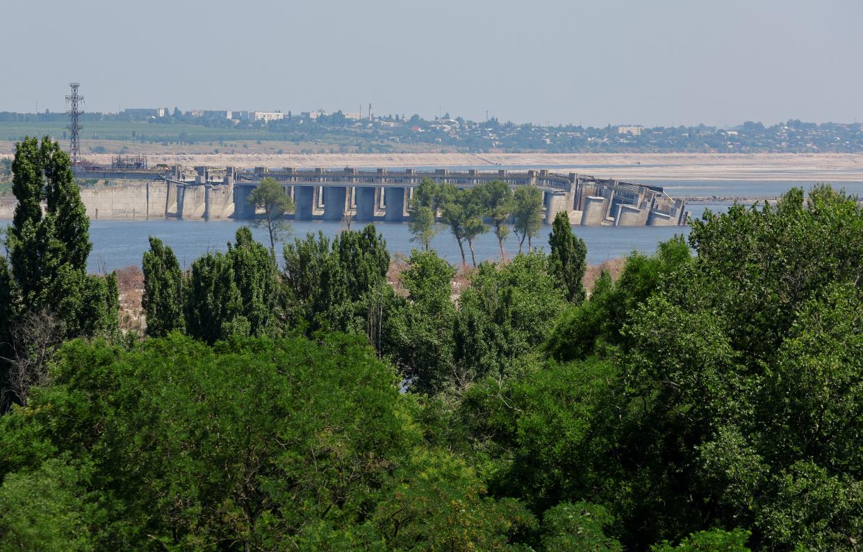 The destroyed Nova Kakhovka dam, Beryslav town and Dnipro river bank, dried-up (REUTERS)