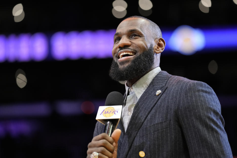 Los Angeles Lakers forward LeBron James speaks during a ceremony honoring him as the NBA's all-time leading scorer before an NBA game against the Milwaukee Bucks on Thursday, Feb. 9, 2023, in Los Angeles. James passed Kareem Abdul-Jabbar to earn the record during Tuesday's NBA game against the Oklahoma City Thunder. (AP Photo/Mark J. Terrill)