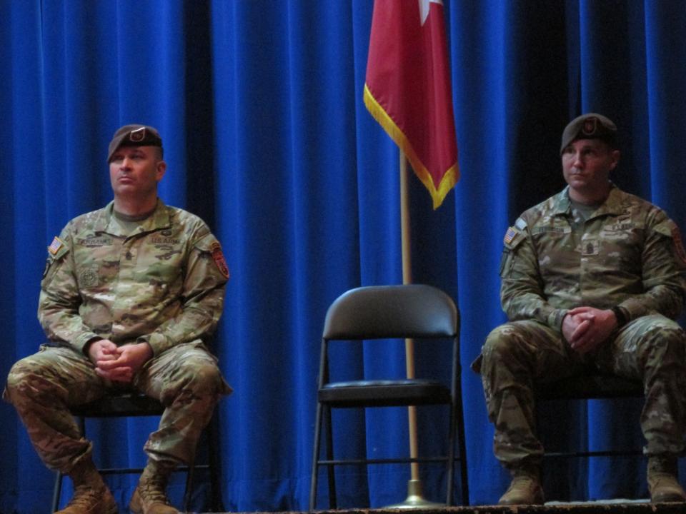 Command Sgt. Maj. Michael Fairbanks, the incoming enlisted leader for the 2nd Security Force Assistance Brigade, and Command Sgt. Maj. Paul Fedorisin, the outgoing enlisted leader, listen to remarks during a change of responsibility ceremony Wednesday, Nov. 22, 2023.