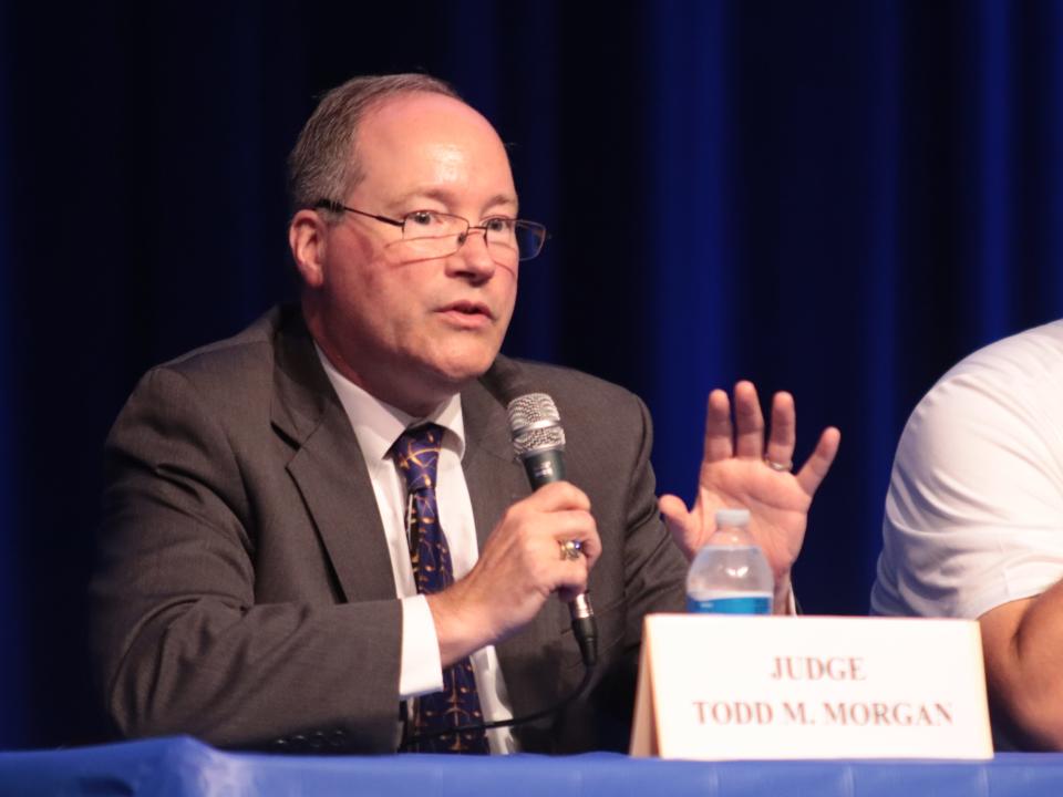 Lenawee County District Judge Todd M. Morgan speaks during a candidate forum Thursday at Adrian High School. He is running to retain is position as district judge.