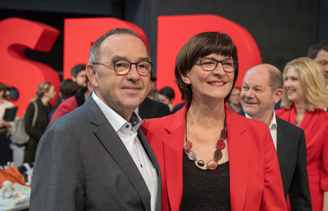 06 December 2019, Berlin: Norbert Walter-Borjans (l-r), candidate for the party chairmanship of the SPD, stands next to Saskia Esken, candidate for the party chairmanship of the SPD, as well as Olaf Scholz, deputy chairman of the SPD and Federal Minister of Finance, and Manuela Schwesig (SPD), Prime Minister of Mecklenburg-Western Pomerania, at the SPD federal party conference. From 06 December 2019 to 08 December 2019, the SPD wants to elect a new leadership team at the party conference. Photo: Bernd von Jutrczenka/dpa (Photo by Bernd von Jutrczenka/picture alliance via Getty Images)