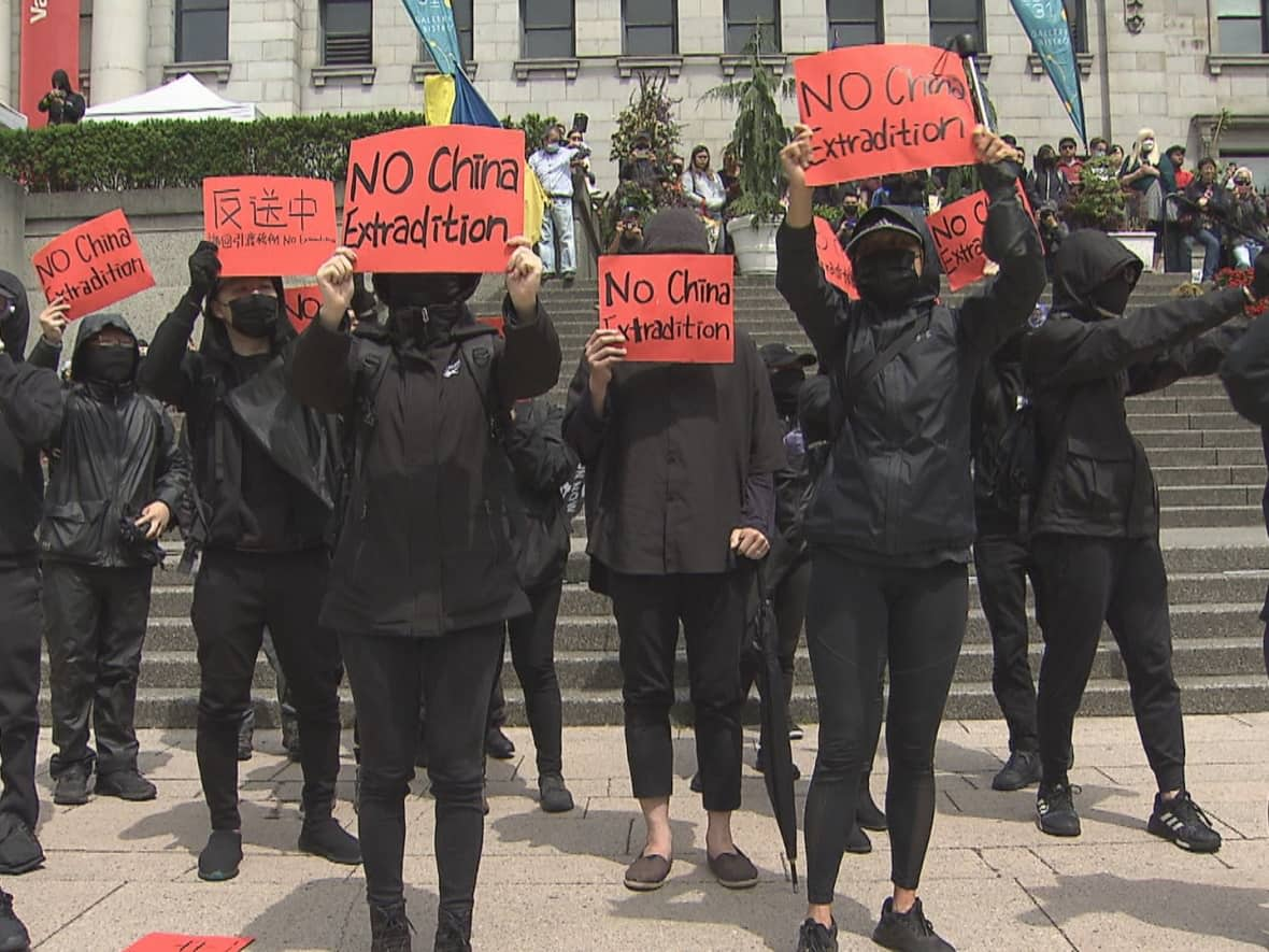 Demonstrators at the Vancouver Art Gallery on Sunday, June 12, 2022 mark the three-year anniversary of the 2019 crackdown on pro-democracy protests in Hong Kong. (CBC News - image credit)