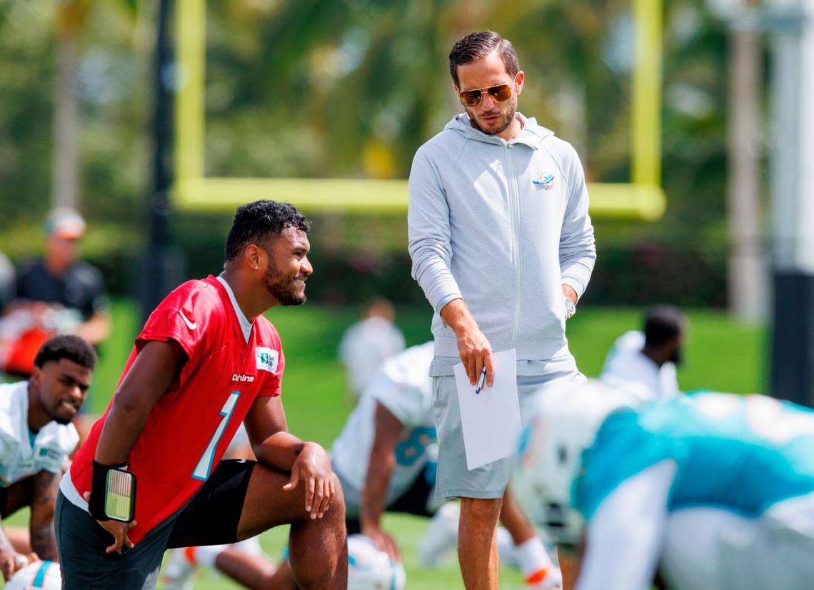 Miami Dolphins quarterback Tua Tagovailoa (1) talks with Dolphins head coach Mike McDaniel during NFL football training camp at Baptist Health Training Complex in Hard Rock Stadium on Monday, September 5, 2022 in Miami Gardens, Florida.