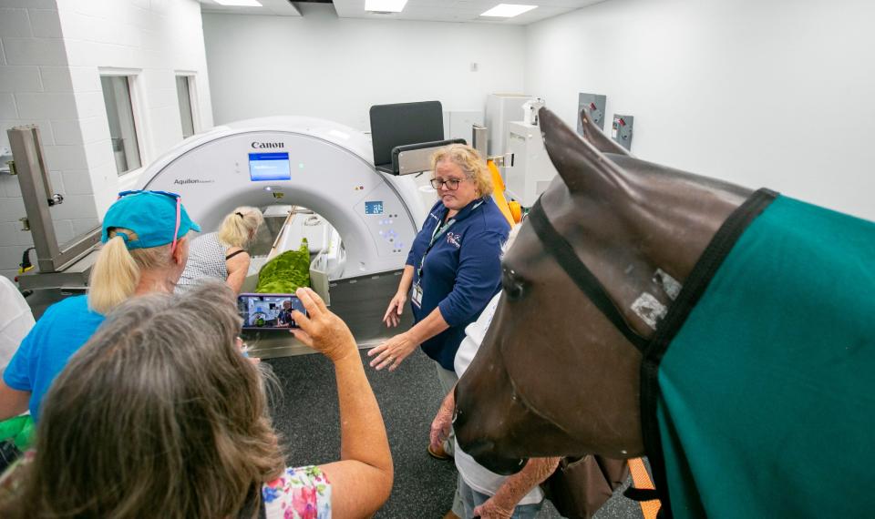 Kelly Higgs-Rick explains the large customized CT scanner designed for horse to be scanned while they stand. The device is one of only two in the world.