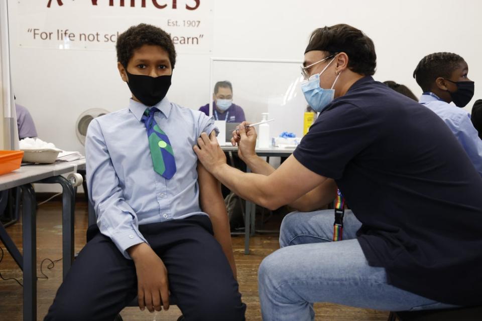 Amin Hamed, 12, receives the Pfizer jab at school (Nigel Howard)