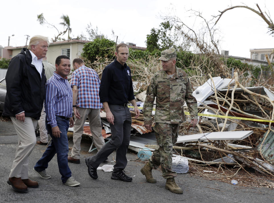 <p>President Donald Trump takes a walking tour to survey hurricane damage and recovery efforts in a neighborhood in Guaynabo, Puerto Rico, Tuesday, Oct. 3, 2017. (Photo: Evan Vucci/AP) </p>