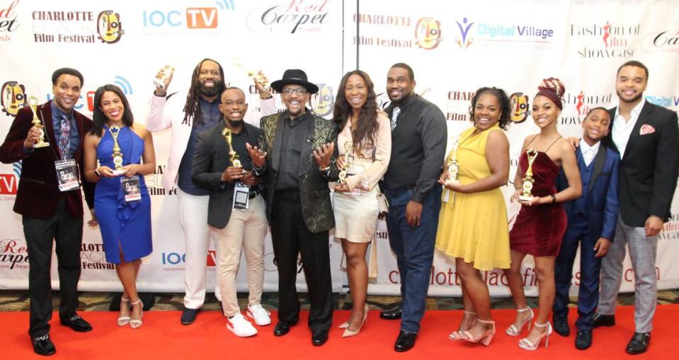 Tommy Nichols (fifth from left) with the winners of the 2022 Red Carpet Vision Awards at the Charlotte Black Film Festival. 