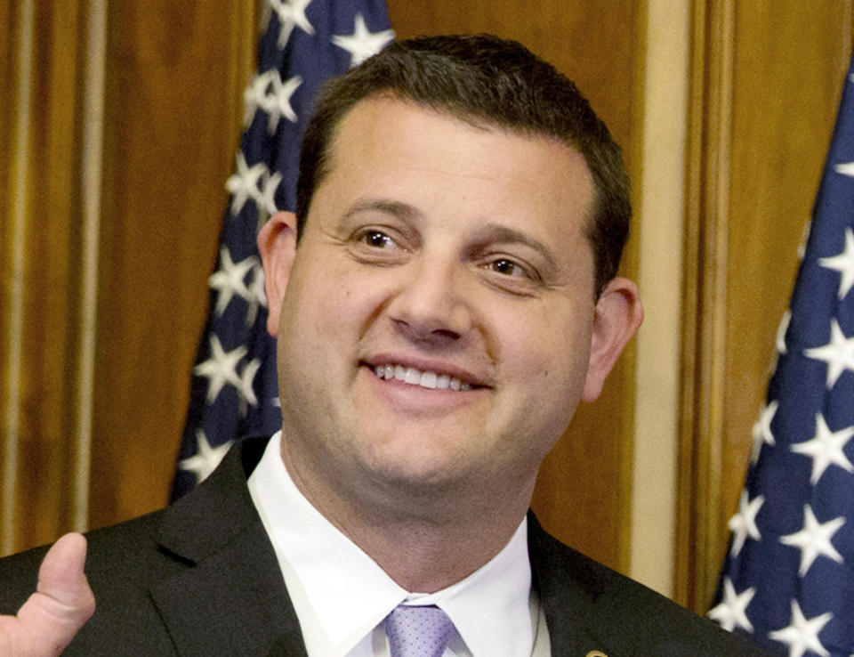 FILE - In this Jan. 6, 2015 file photo, then-Rep. David Valadao, R-Calif., poses during a ceremonial re-enactment of his swearing-in ceremony in the Rayburn Room on Capitol Hill in Washington. Republicans are eager to recapture a string of California U.S. House seats a that the party lost in a 2018 rout, but the job is looking tougher: The numbers are running against them. State voter registration statistics show Democrats gaining ground in key battleground districts that the party seized two years ago, on its way to regaining control of the House. This year, former GOP Rep. David Valadao is trying to reclaim the seat from Democratic Rep. T.J. Cox, who took it from him in 2018. (AP Photo/Jacquelyn Martin, File)