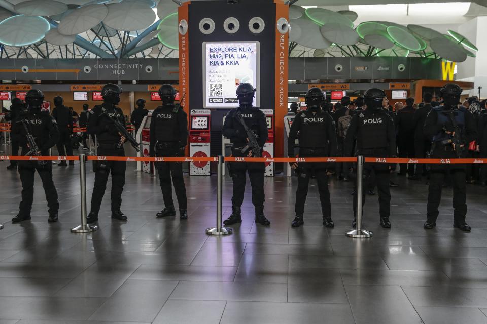 Heavily armed police guarded the group (EPA)