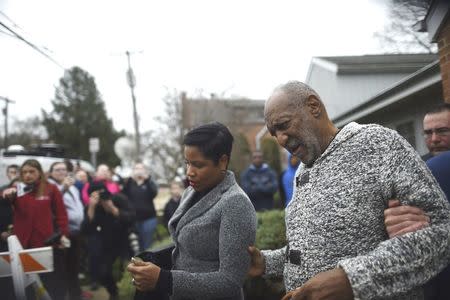 Actor and comedian Bill Cosby (R) speaks to attorney Monique Pressley as they exit the Montgomery County Courthouse after Cosby was arraigned on sexual assault charges in Elkins Park, Pennsylvania December 30, 2015. REUTERS/Mark Makela