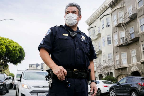 PHOTO: Officer Nestor Guevarra watches as a car is towed after parking illegally in front of a residence in San Francisco, Calif., Jan. 13, 2022. (Bronte Wittpenn/San Francisco Chronicle via Getty Images, FILE)