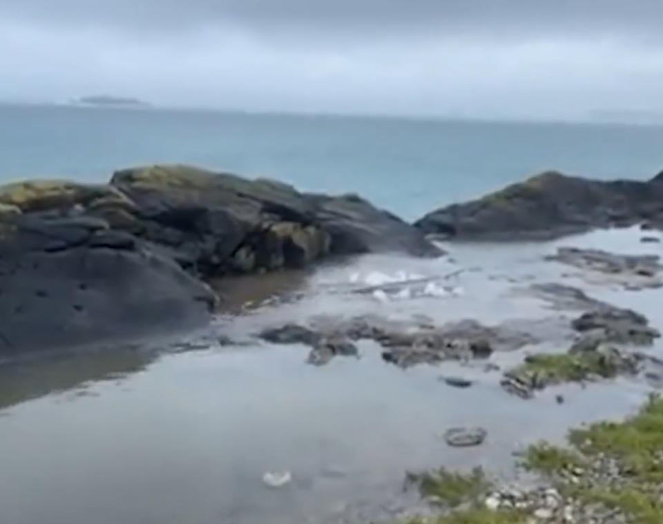 The storm overflow was gushing out into the water by the ocean. (Reach)