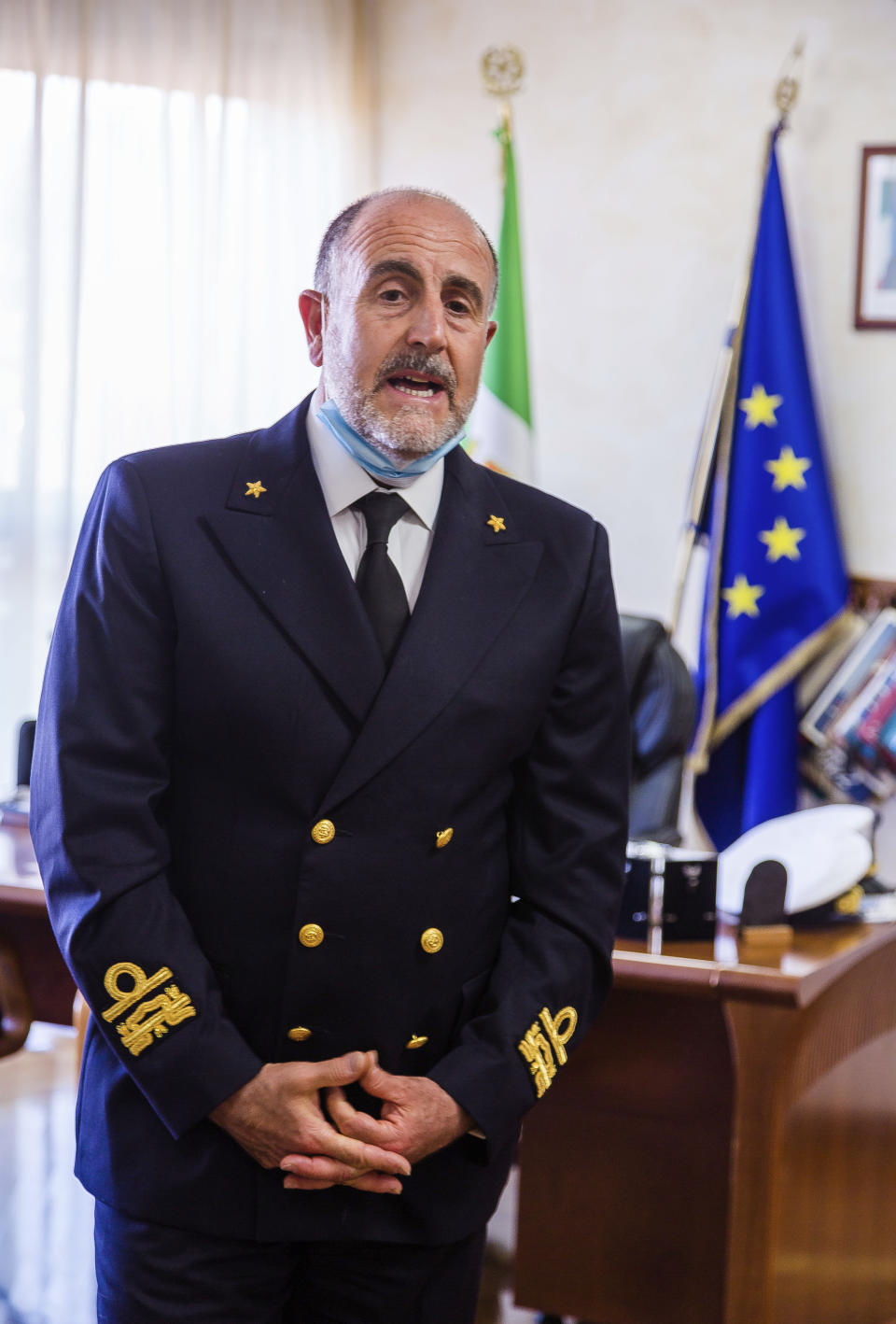 In this picture taken on Thursday, May 21, 2020, Admiral Vincenzo Leone, head of the Lazio region Coast Guard, speaks during an interview with The Associated Press in Fiumicino, near Rome. “This is a unique moment, that we hope will never happen again. In this moment most of the productive activities in the coastal towns and villages, stopped. The sea had something to tell us, we have listened to it and we are checking". Preliminary results from a survey of seawater quality during Italy’s coronavirus lockdown indicate a sharp reduction in pollution from human and livestock waste in the seas off Rome. (AP Photo/Domenico Stinellis)
