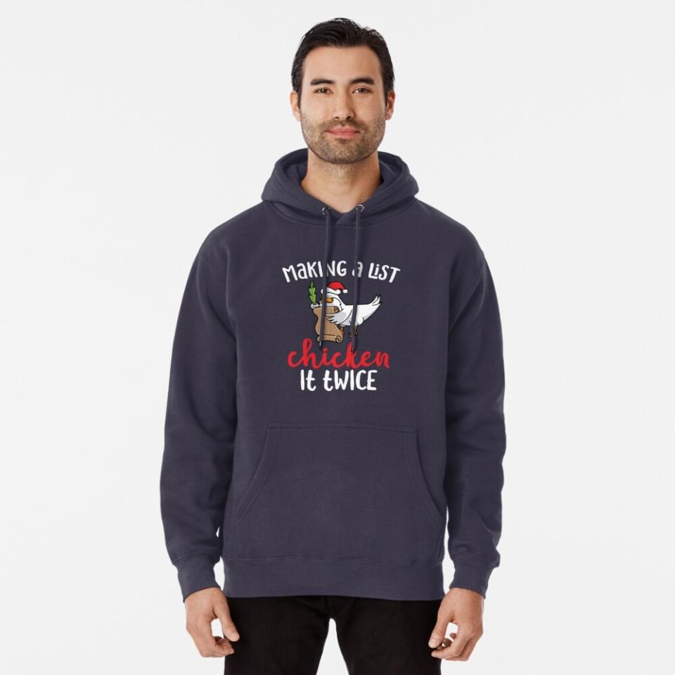 Man wearing a Christmas sweatshirt from Redbubble with a chicken on it