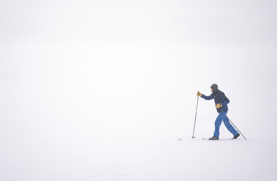 Ted Weissman skis on Lake Harriet Wednesday, Dec. 21, 2022 in Minneapolis. Weissman is visiting his brother-in-law from West Virginia. "This is like heaven for me," he said. (Alex Kormann /Star Tribune via AP)