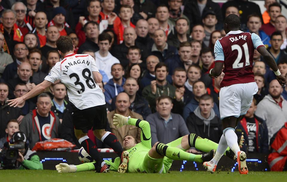 West Ham United's goalkeeper Adrian (C) concedes a penalty with a challenge on Liverpool's Jon Flanagan (L) during their English Premier League soccer match at Upton Park in London, April 6, 2014. REUTERS/Dylan Martinez (BRITAIN - Tags: SPORT SOCCER) FOR EDITORIAL USE ONLY. NOT FOR SALE FOR MARKETING OR ADVERTISING CAMPAIGNS. NO USE WITH UNAUTHORIZED AUDIO, VIDEO, DATA, FIXTURE LISTS, CLUB/LEAGUE LOGOS OR "LIVE" SERVICES. ONLINE IN-MATCH USE LIMITED TO 45 IMAGES, NO VIDEO EMULATION. NO USE IN BETTING, GAMES OR SINGLE CLUB/LEAGUE/PLAYER PUBLICATIONS