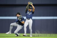 Tampa Bay Rays second baseman Richie Palacios, right, catches a pop fly by Toronto Blue Jays' Danny Jansen as right fielder Josh Lowe avoids colliding with him during the fifth inning of a baseball game Friday, May 17, 2024, in Toronto. (Christopher Katsarov/The Canadian Press via AP)