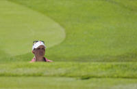 Nanna Koerstz Madsen, of Denmark, studies her shot from a bunker on the 9th green during the second round of the women's golf event at the 2020 Summer Olympics, Thursday, Aug. 5, 2021, at the Kasumigaseki Country Club in Kawagoe, Japan. (AP Photo/Andy Wong)