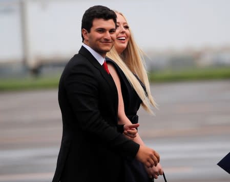 Tiffany Trump walks with her boyfriend Michael Boulos after arriving for a campaign rally in Orlando