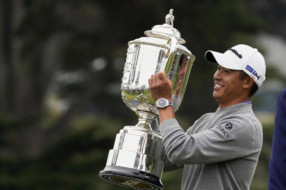 Collin Morikawa holds the Wanamaker Trophy after winning the PGA Championship golf tournament at TPC Harding Park Sunday, Aug. 9, 2020, in San Francisco. (AP Photo/Charlie Riedel)