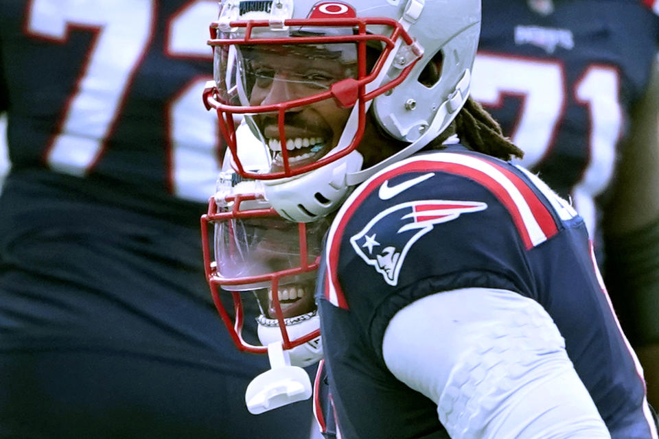 New England Patriots quarterback Cam Newton, front, and running back James White, rear, celebrate after Newton threw a touchdown pass to White in the first half of an NFL football game against the New York Jets, Sunday, Jan. 3, 2021, in Foxborough, Mass. (AP Photo/Elise Amendola)