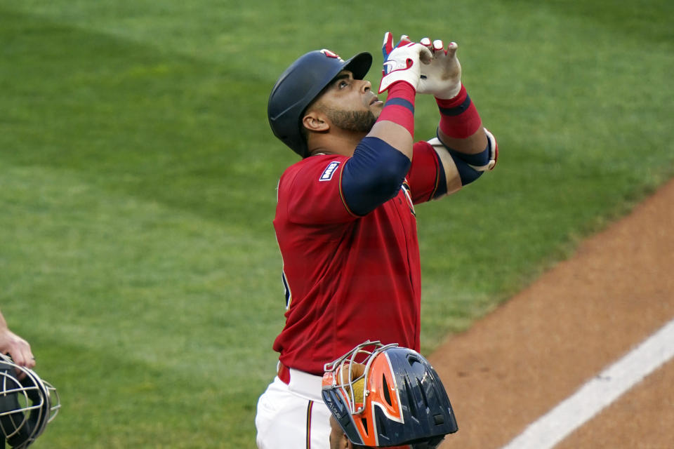 Minnesota Twins' Nelson Cruz celebrates after his solo home run off Houston Astros pitcher Jose Urquidy as he scores in the first inning of a baseball game, Friday, June 11, 2021, in Minneapolis. (AP Photo/Jim Mone)